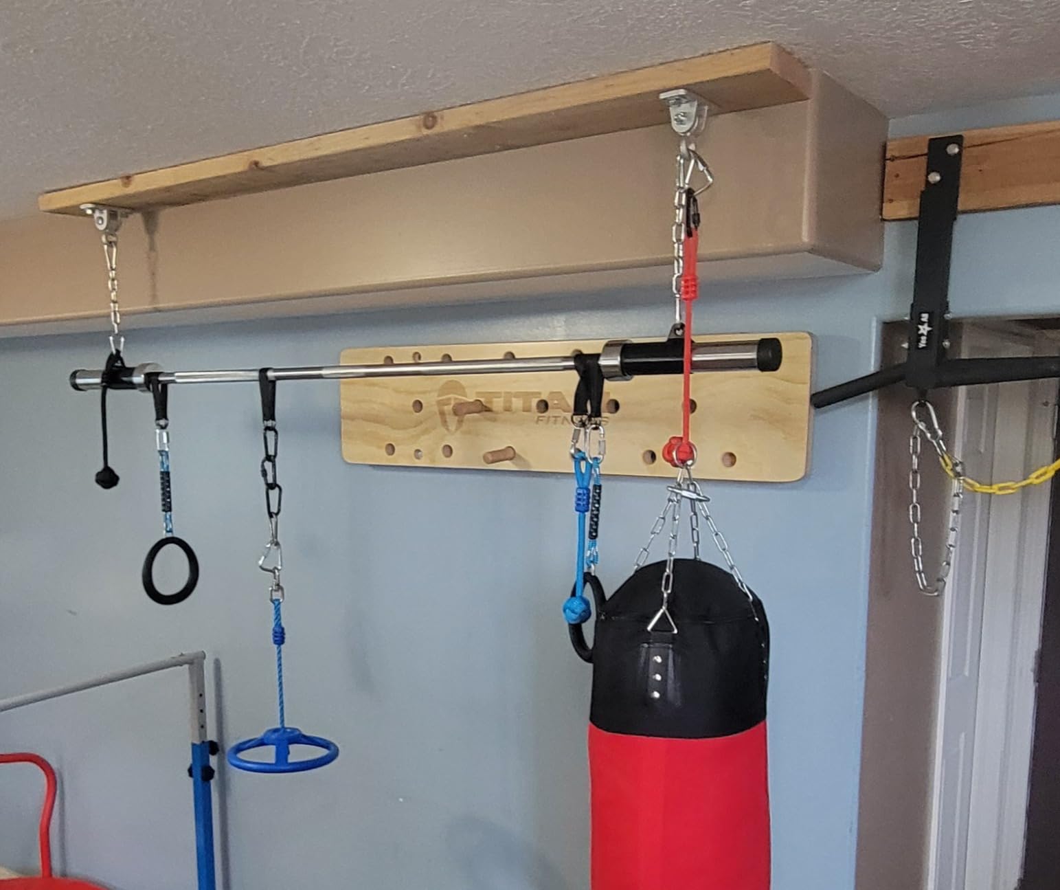 Titan Fitness 4 FT Climbing Pegboard, Wall-Mounted Climbing Board, Sturdy Birch Wood Pegboard Climbing Wall with Wooden Dowel Pegs, 17 Staggered Climbing Holes customer photo 1